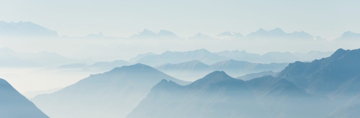 Beautiful shot of high white hilltops and mountains covered in fog - amazing aesthetic natural backgrounds